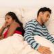 Worried couple in bed - emergency contraception