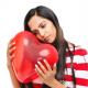 Lovesick woman with a heart balloon