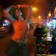 Woman dancing in the streets of Delhi at night
