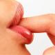 Woman's lips sucking her finger