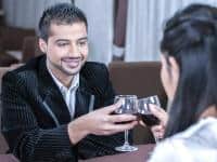 Couple flirting over a glass of wine